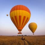 Hot air balloons over the Masai Mara, Kenya.