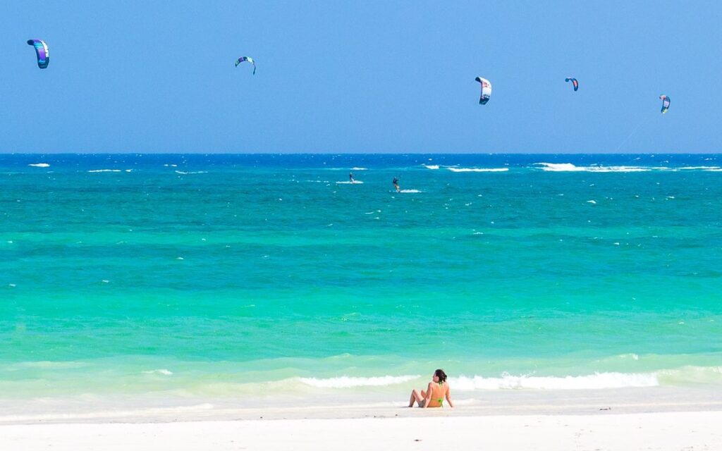 Tourist relaxing on Diani beach in Kenya.