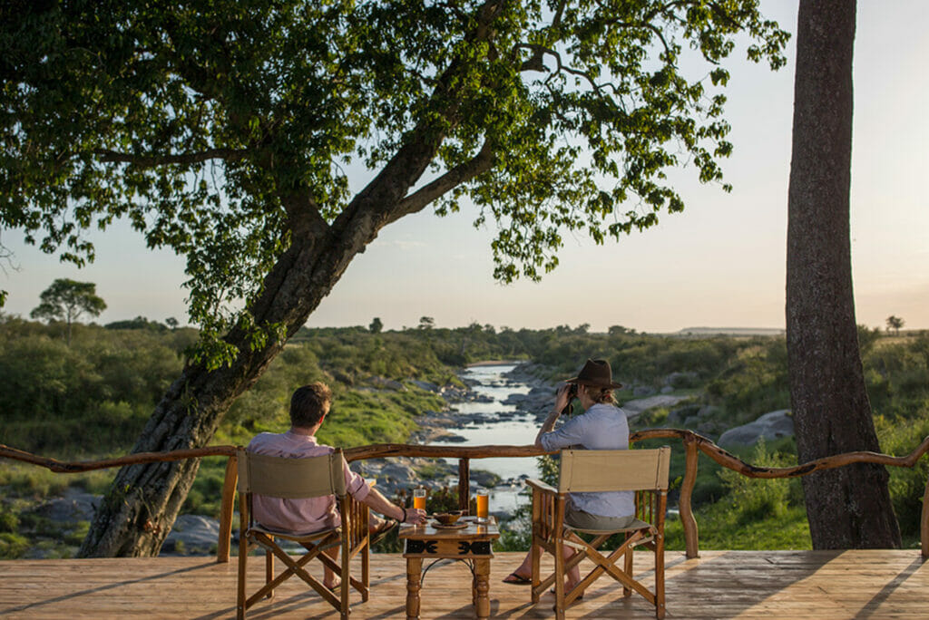 Tourists enjoying the view from the deck at Rekero, Kenya | Photo credit: Rekero