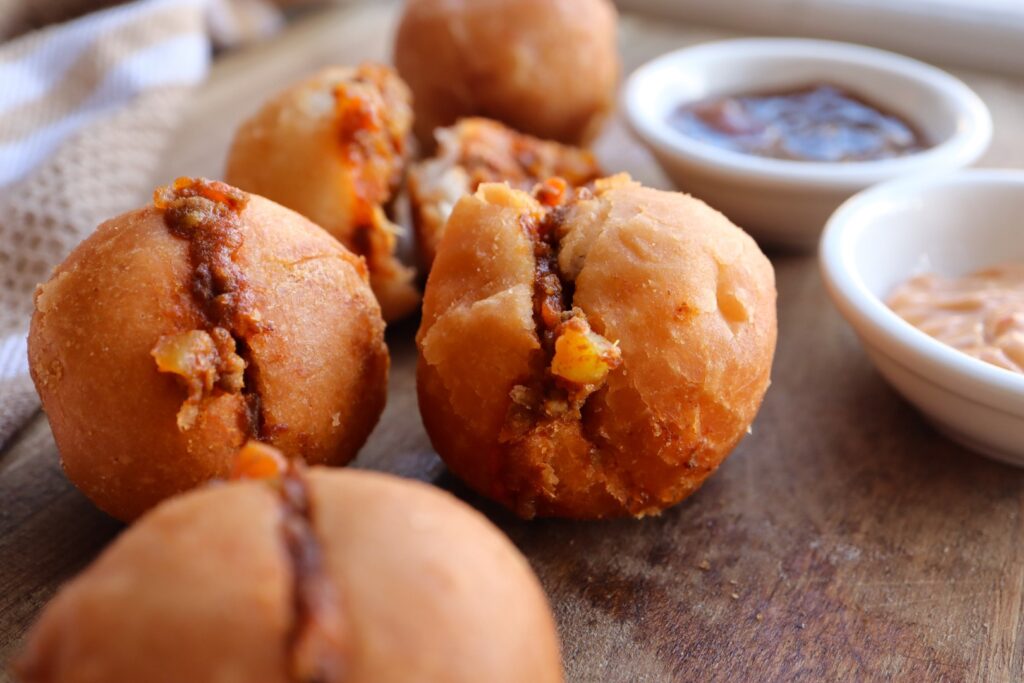 Mini vetkoek with mince curry filling. Photo: Getty Images