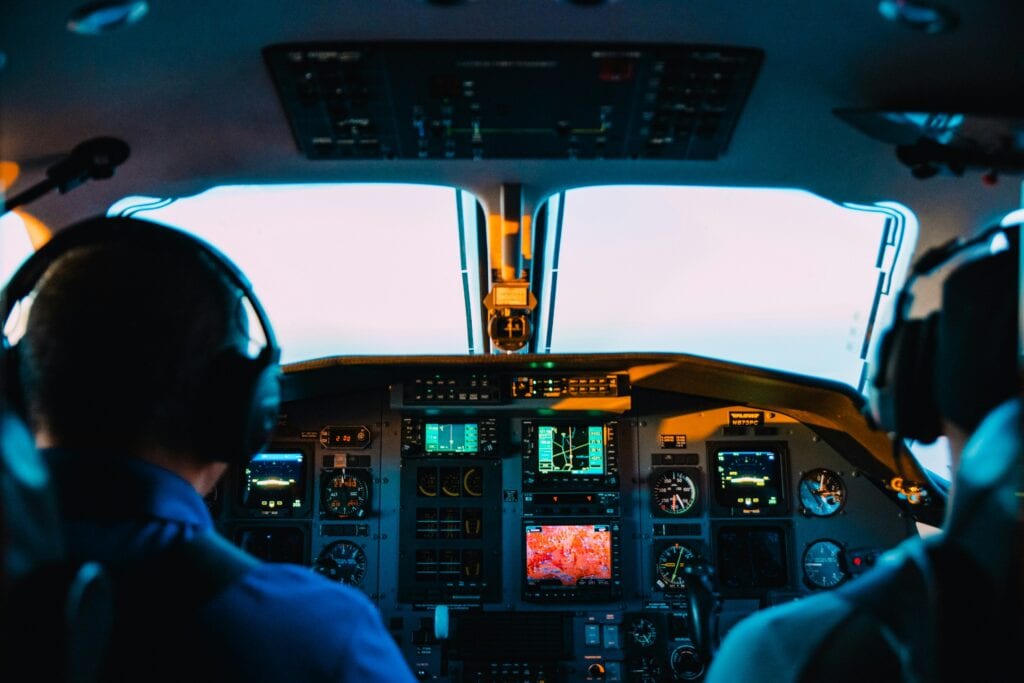 View of the cockpit inside an aeroplane. Photo: Caleb Woods from Unsplash