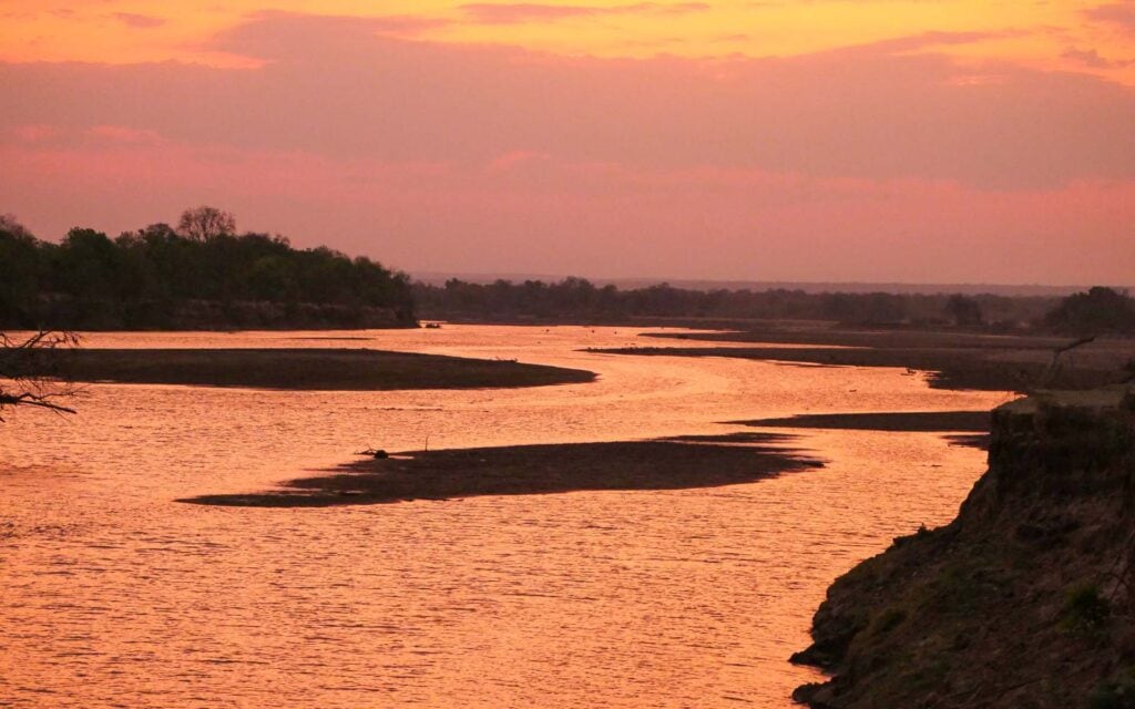 View of a orange and pink sunset over the Zambezi River