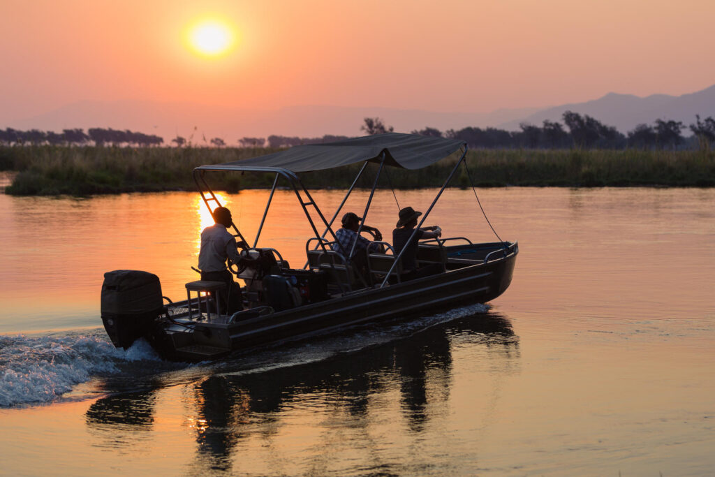 A private boat cruise at sunset on the river