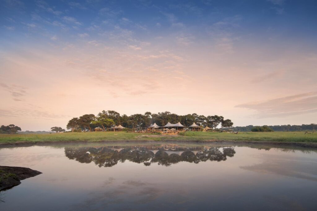 Exterior view of Somalisa Camp from the river | Photo credit: Camp Somalisa